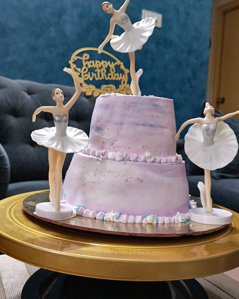 Two-tier pink ballerina cake with ballerina toppers