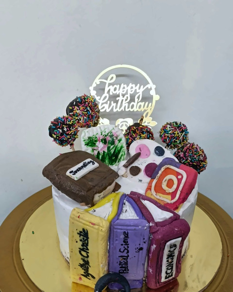 Social-media themed personalised birthday cake with props
