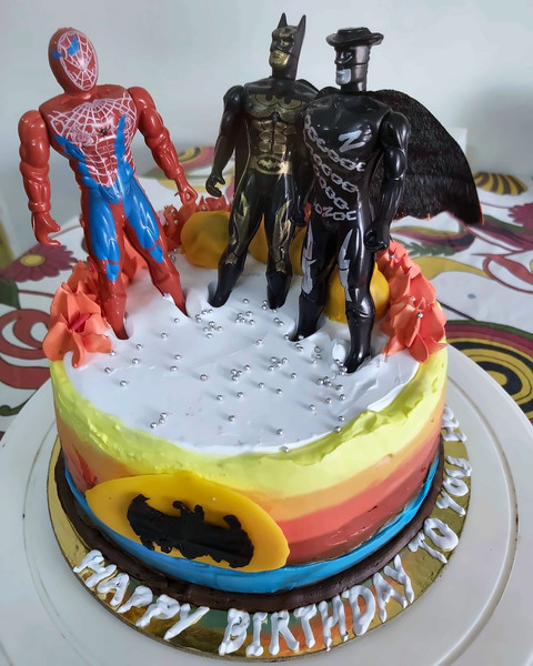 Superhero birthday cake with Spiderman and Batman toppers